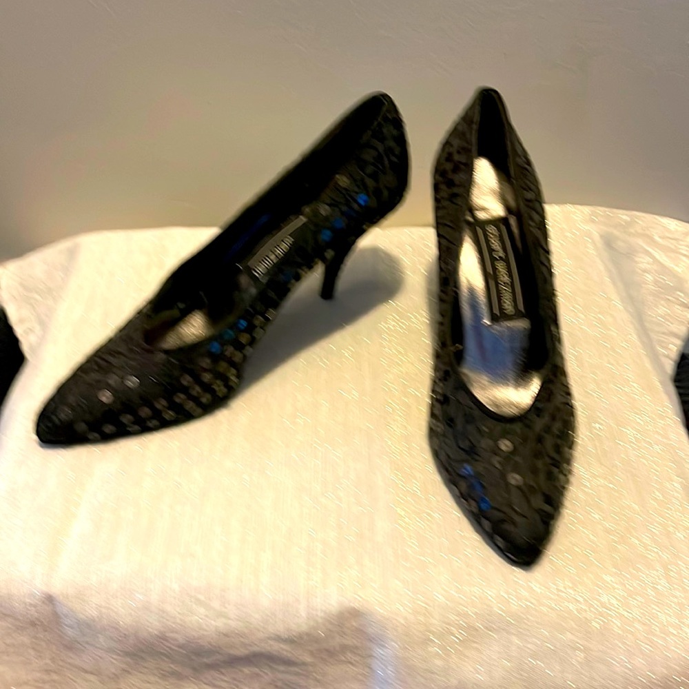 Stuart Weitzman black heels with black sequence.